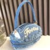 product-fancy-0ce8cc8d-9ae5-4f7c-9558-d347fe10ca7e Denim Football-Shaped Handbag with Fringe and Adjustable Strap - Blue, Casual Style, Zip Closure, PU Lining - Perfect for Football Fans