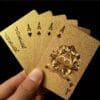 product-fancy-135a1093-e6d4-46f0-947f-274ffc7257a4 Golden Waterproof Plastic Playing Cards - Elegant Golden Foil Design with Ornate Spade & Heart Motifs for Poker, Bridge, Rummy - Durable Deck for Home Game Nights & Professional Play, Playing Cards Deck