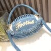 product-fancy-a3998db0-b0e7-4c87-98f1-b3d897b2d0c3 Denim Football-Shaped Handbag with Fringe and Adjustable Strap - Blue, Casual Style, Zip Closure, PU Lining - Perfect for Football Fans