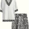 Men's casual vacation style set, white diamond patterned V-neck mid sleeved top paired with black and white geometric printed shorts