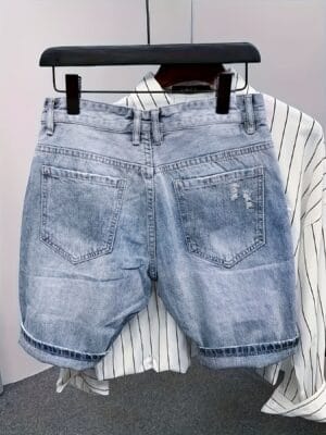 product-fancy-c1c8861e-31ed-4393-b0aa-31947a145d55 Men's Distressed Denim Shorts with Skull & Sickle Print, Zipper Details, and Faux Pockets - Street Style Knee-Length Halloween Design