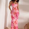9077ffb775398690ecf69a1460f5b6fb_38fd47df14d5.jpg Robe longue moulante à imprimé floral pour femme - Sans manches, dos nu, bretelles croisées, motif floral rose et blanc, idéale pour les vacances, les rendez-vous galants, les fêtes, la plage et les tenues décontractées. Robe de plage