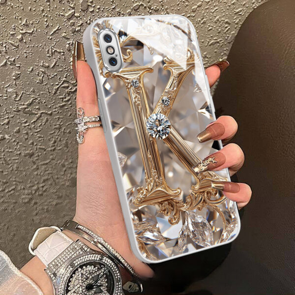 0c4116ce27de45fca945aafe57bc7aef-goods.jpeg A Robust And Durable Golden Diamond Letter Case Designed for Various for iphone Models, Including X, XR, Xs Max, 8, 7 Plus, And 6S SE, Featuring Electroplated Glass for Shockproof Drop Protection.